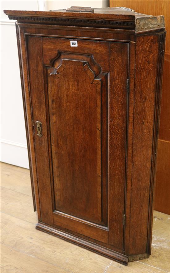 A George III oak corner cabinet W.67cm (a.f.)